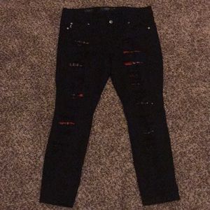 Torrid ripper black jeans with red plaid under